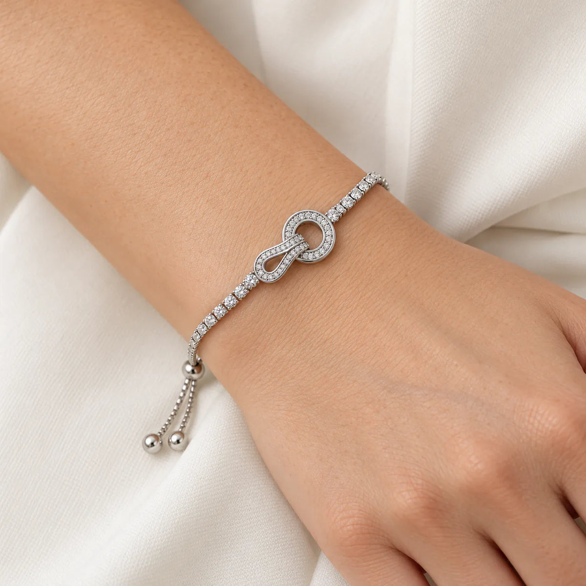 Tennis Bracelet with Circle charm & Infinity Loop - on model